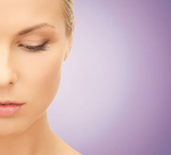 Close up of beautiful young woman looking down — Stock Photo, Image