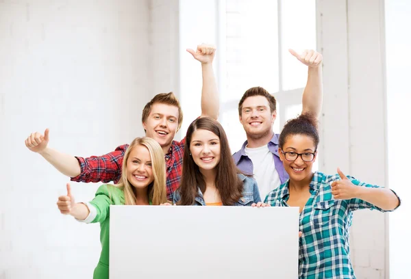 Group of students at school with blank board — Stock Photo, Image