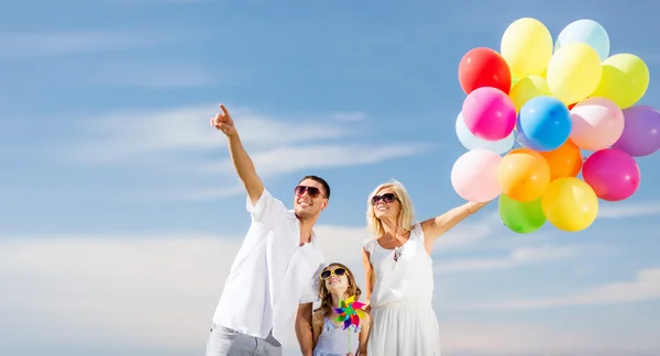 Family with colorful balloons — Stock Photo, Image