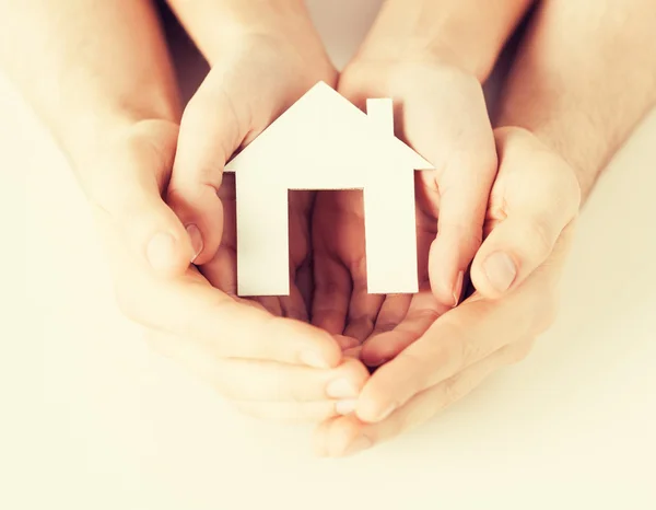 Woman and hands with paper house — Stock Photo, Image