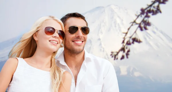 Couple in shades at sea side — Stock Photo, Image