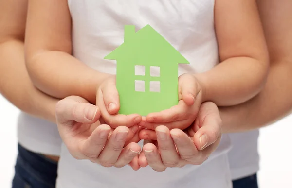 Close up of woman and girl hands with paper house — Stock Photo, Image