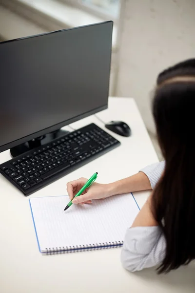 Close up of sad woman with computer and notebook — Stock Photo, Image