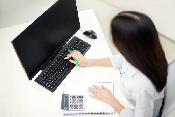 Close up of woman with calculator counting — Stock Photo, Image