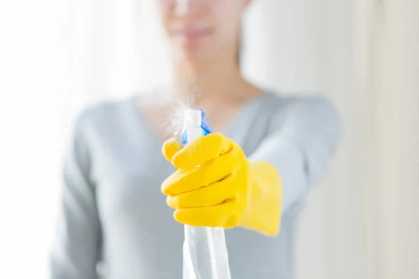 Close up of happy woman with cleanser spraying — Stock Photo, Image