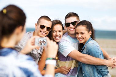 teenagers taking photo outside clipart