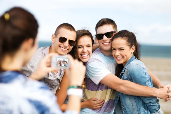 Teenagers taking photo outside Stock Image