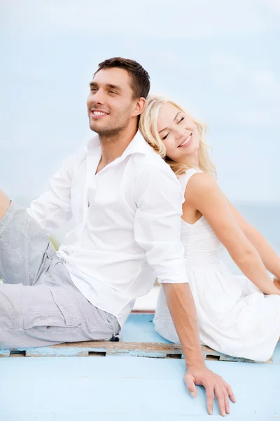 Couple in shades at sea side — Stock Photo, Image
