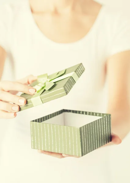 Woman hands with gift box — Stock Photo, Image