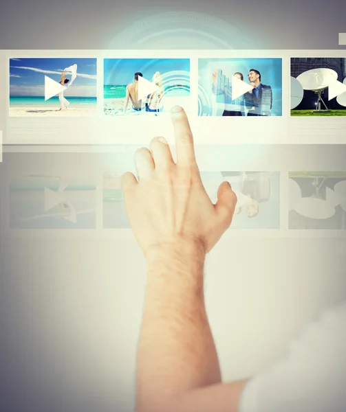 Man pressing button on virtual screen — Stock Photo, Image
