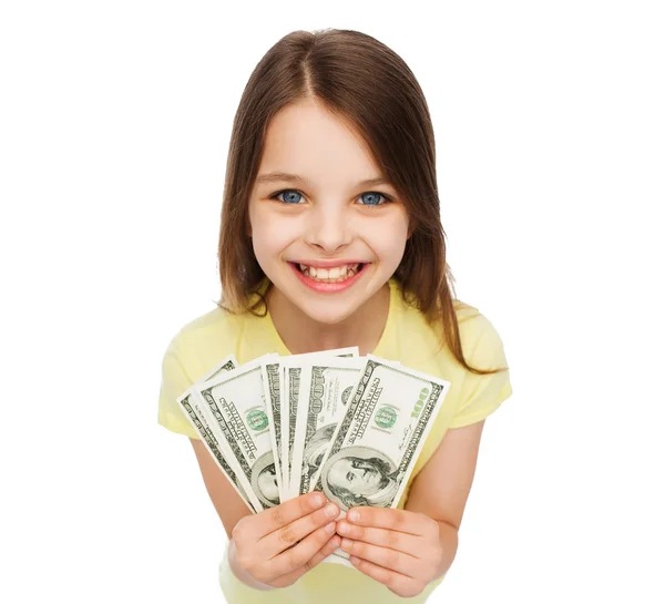 Sorridente bambina con denaro contante dollaro — Foto Stock