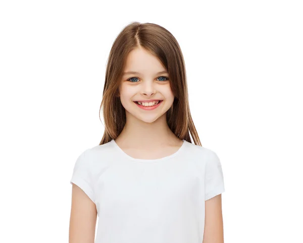 Smiling little girl in white blank t-shirt — Stock Photo, Image