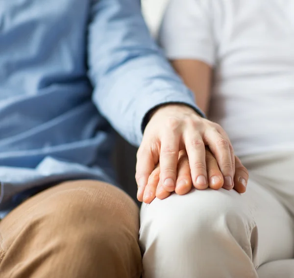 Close up of happy male gay couple holding hands — Stock Photo, Image