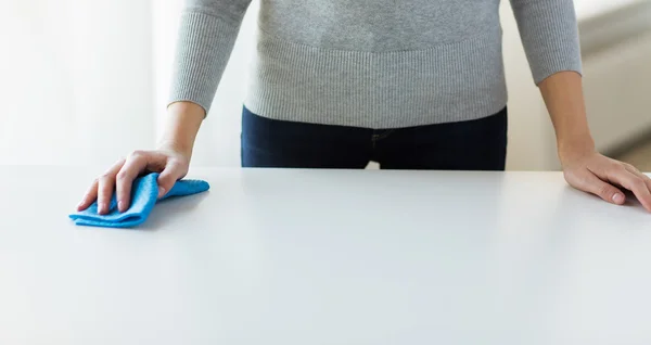 Close up of woman cleaning table with cloth — Stock Photo, Image