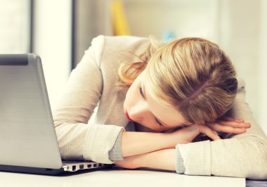 tired woman with laptop computer clipart