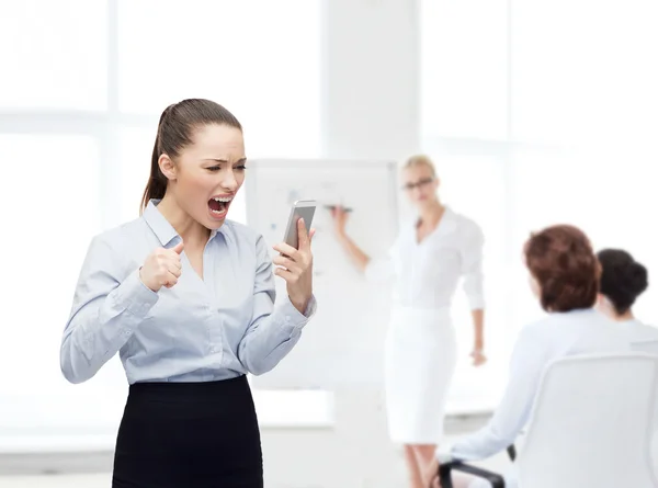 Screaming businesswoman with smartphone — Stock Photo, Image