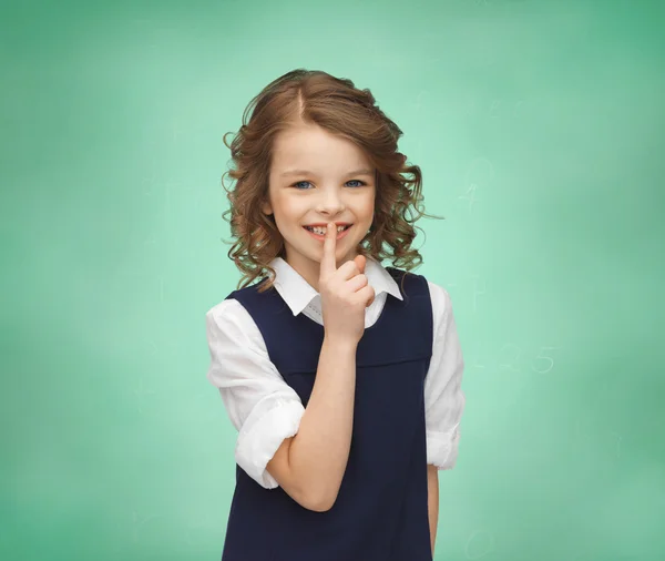Happy girl showing hush gesture — Stock Photo, Image