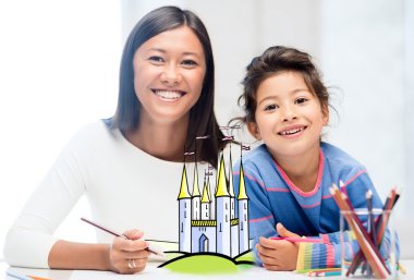 happy mother and daughter drawing at home clipart