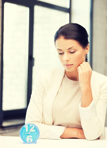 Businesswoman with clock — Stock Photo, Image