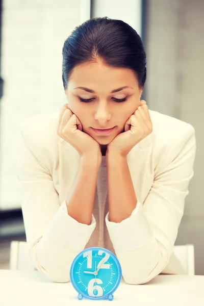 Businesswoman with clock — Stock Photo, Image