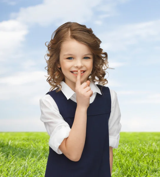 Happy girl showing hush gesture — Stok fotoğraf