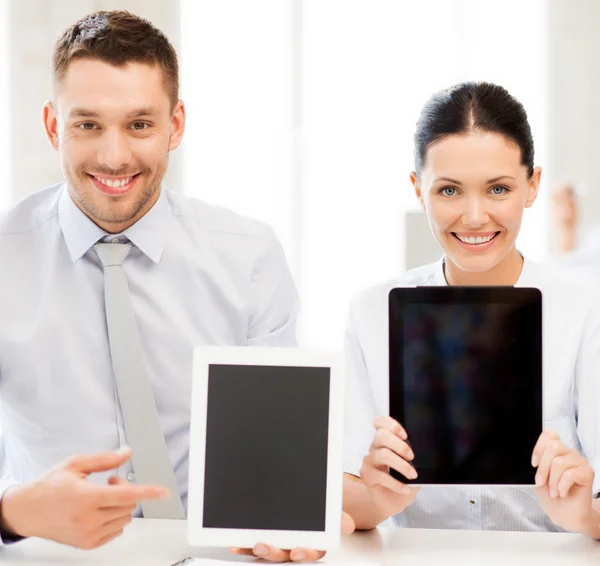 Business team showing tablet pcs in office — Stock Photo, Image