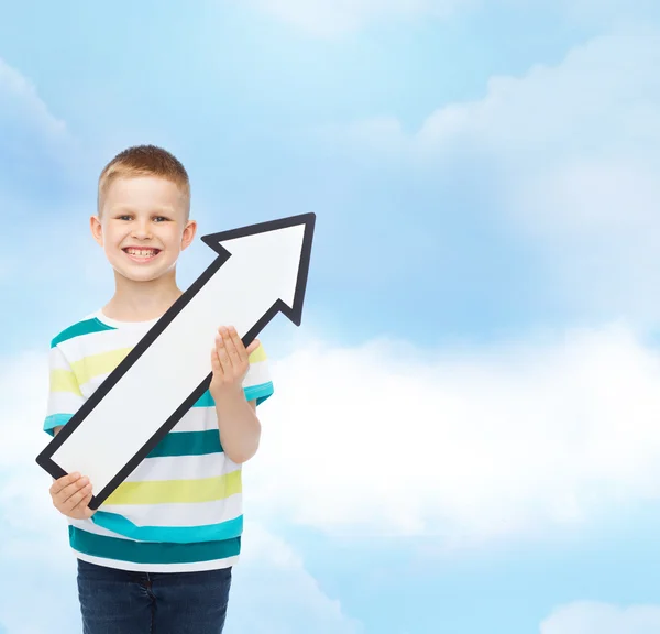 Niño sonriente con flecha en blanco apuntando a la derecha —  Fotos de Stock
