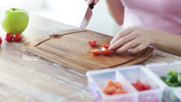 Close up of woman chopping vegetables at home — Stock Video