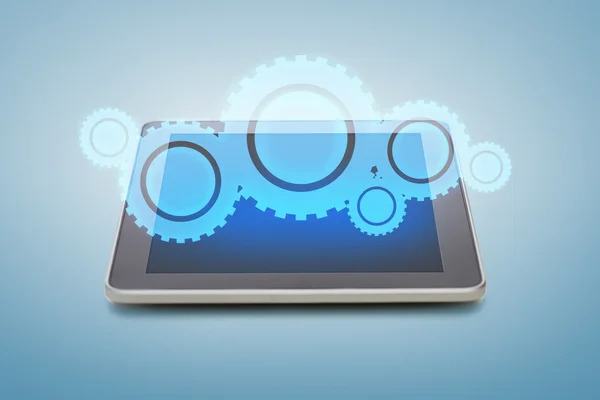 Tablet pc with cogwheel icon over screen — Stock Photo, Image