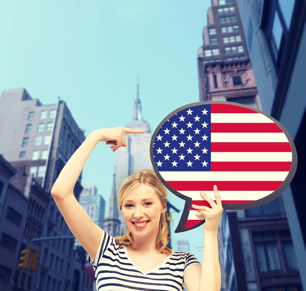 Smiling woman with text bubble of american flag — Stock Photo, Image