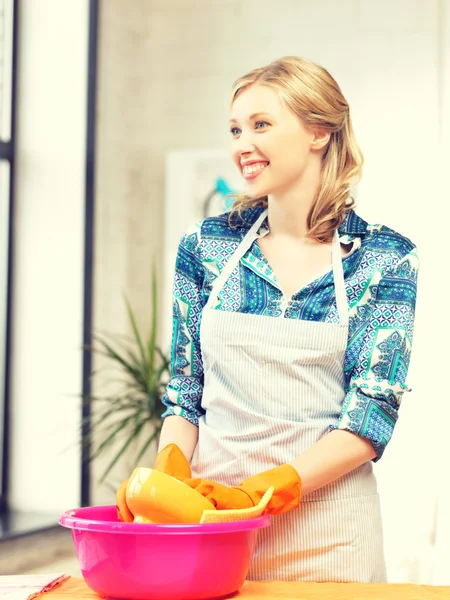 Housewife washing dish at the kitchen — Stock Photo, Image