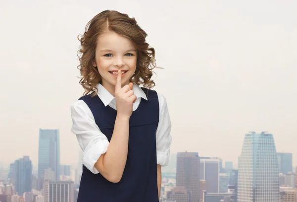 Happy girl showing hush gesture — Stock Photo, Image