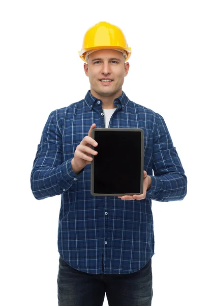 Sorridente construtor masculino no capacete com tablet pc — Fotografia de Stock