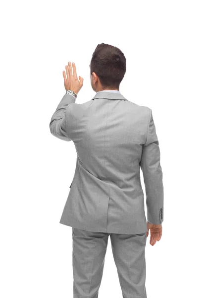 Businessman touching something imaginary — Stock Photo, Image