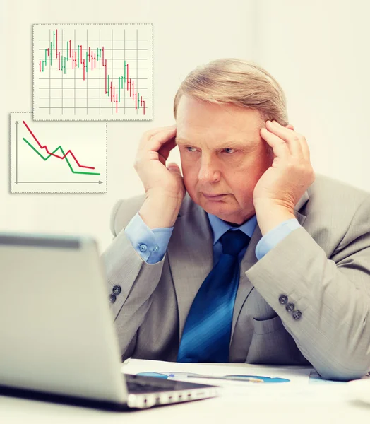 Upset older businessman with laptop in office — Stock Photo, Image