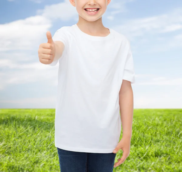 Close up of boy in white t-shirt showing thumbs — Stock Photo, Image