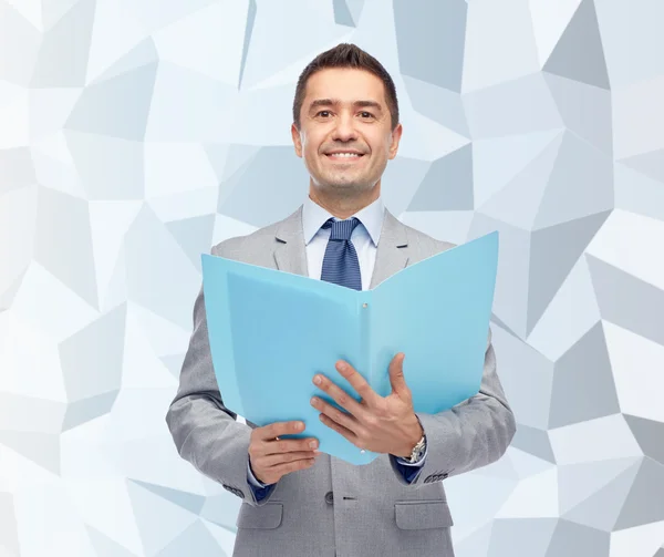 Happy businessman with open folder — Stock Photo, Image