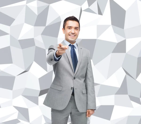 Happy smiling businessman in suit pointing at you — Stock Photo, Image