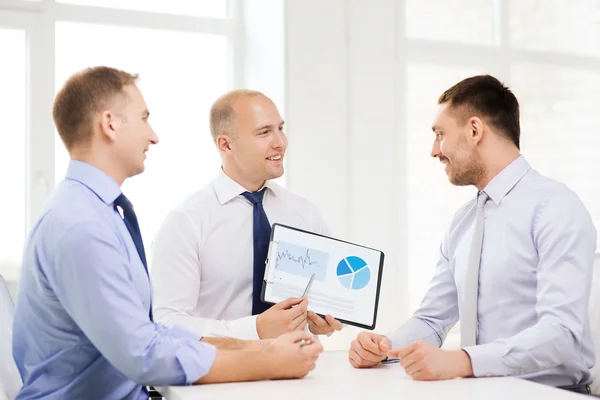 Smiling businessmen with papers in office — Stock Photo, Image