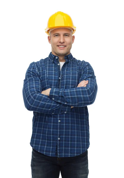 Smiling male builder or manual worker in helmet — Stock Photo, Image