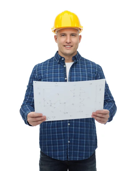 Constructor masculino sonriente en casco con plano —  Fotos de Stock