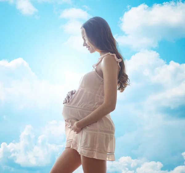 Happy pregnant woman in chemise — Stock Photo, Image