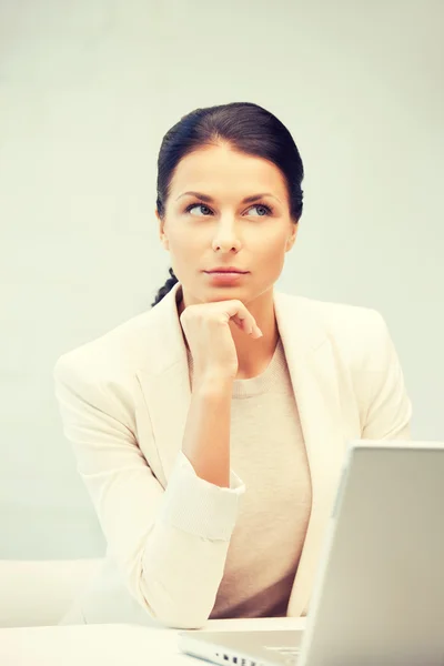 Pensive woman with laptop computer — Stock Photo, Image