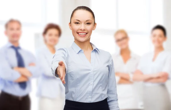 Businesswoman with opened hand ready for handshake Stock Picture