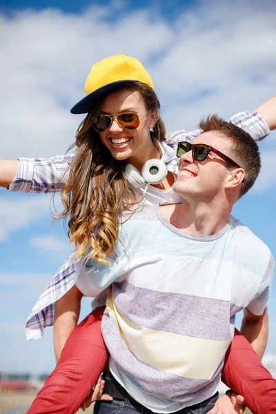 Smiling teenagers in sunglasses having fun outside — Stock Photo, Image