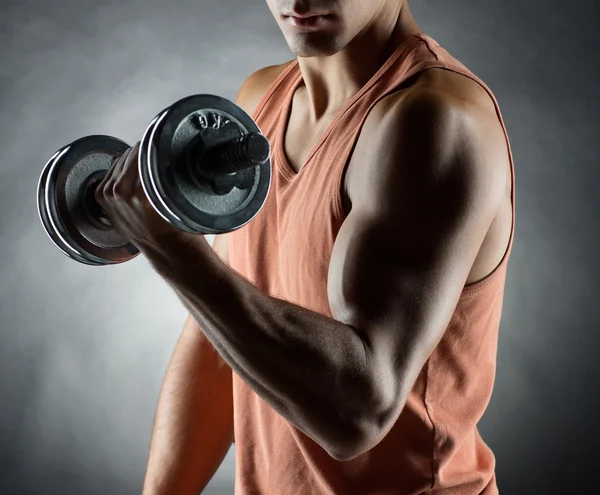 young man with dumbbell