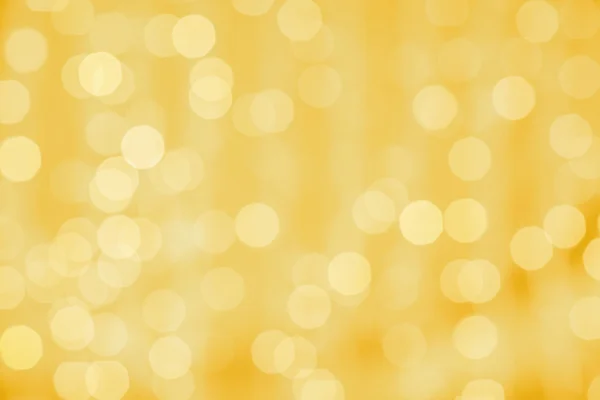 Bokeh ışıkları ile altın arka plan bulanık — Stok fotoğraf