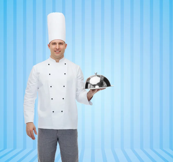 Happy male chef cook holding cloche — Stock Photo, Image