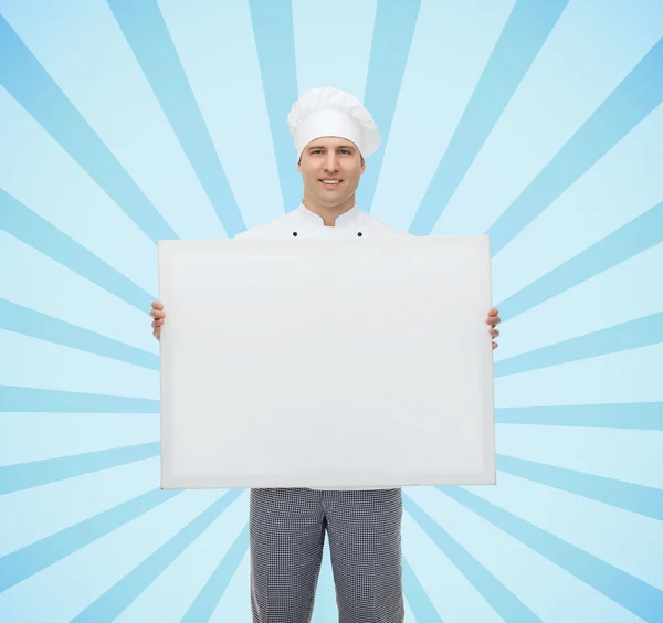 Feliz cozinheiro masculino chef segurando branco placa grande em branco — Fotografia de Stock