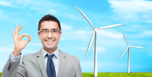 Happy smiling businessman in eyeglasses and suit — Stock Photo, Image